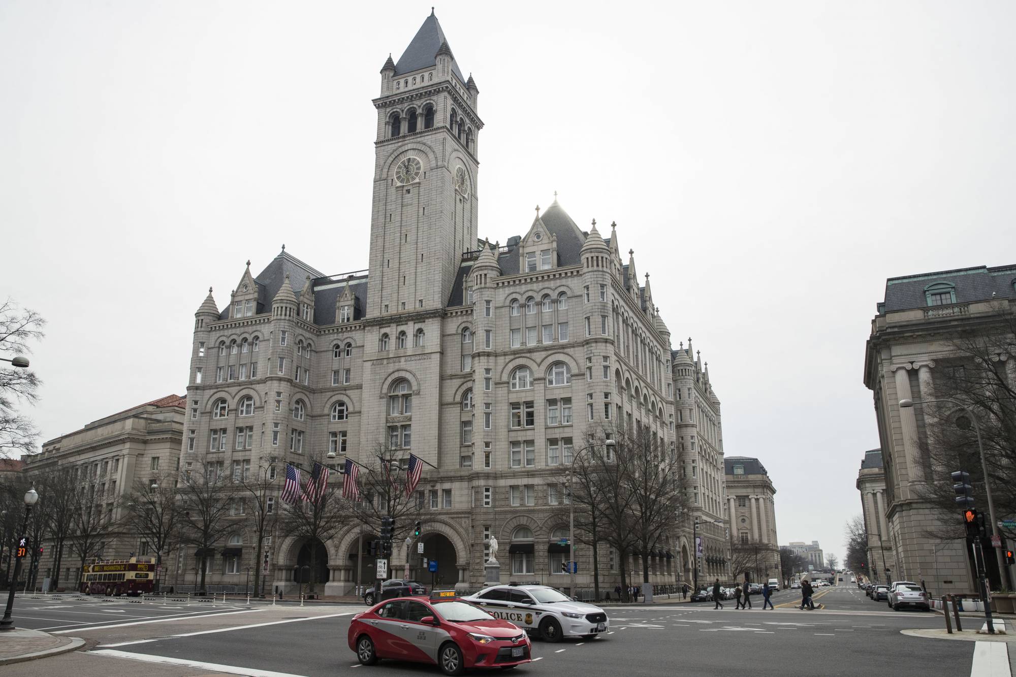 The Old Post Office Pavilion Clock Tower, which remains open during the partial government shutdown, is seen above the Trump International Hotel, Friday, Jan. 4, 2019 in Washington. (AP Photo/Alex Brandon)