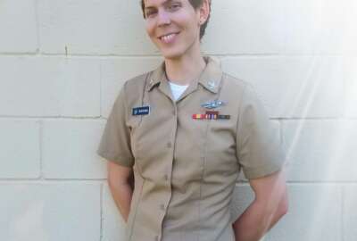 This 2017 photo provided by Lambda Legal in January 2019 shows Megan Winters at Joint Base Anacostia-Billing in Washington. Among those active-duty trans service members is Winters, 30, a plaintiff in the Lambda-Outserve lawsuit who has been in the Navy almost six years.  She formerly served with the Office of Naval Intelligence in Washington and now is assigned to the aircraft carrier USS George H. W. Bush, based in Norfolk, Va. 