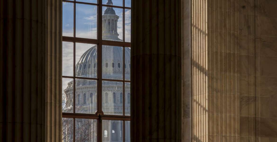 FILE- In this Dec. 27, 2018, file photo the Capitol Dome is seen from the Russell Senate Office Building in Washington during a partial government shutdown. On Thursday, Jan. 31, 2019, the Labor Department reports on the number of people who applied for unemployment benefits last week. (AP Photo/J. Scott Applewhite, File)
