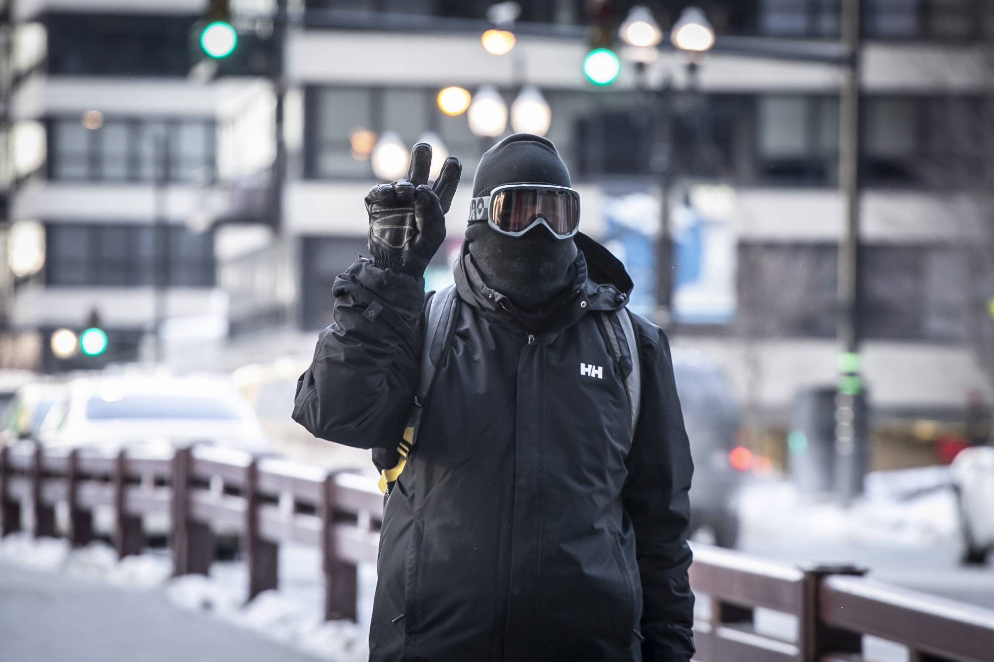 A bundled-up commuter makes their way through the loop early Wednesday, Jan. 30, 2019 in Chicago.  A deadly arctic deep freeze enveloped the Midwest with record-breaking temperatures triggering widespread closures of schools and businesses.  (Rich Hein/Chicago Sun-Times via AP)