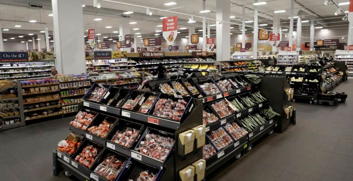 FILE- This April 30, 2018, file photo shows an interior view of the Sainsbury's flagship store in the Nine Elms area of London. British regulators say the proposed supermarkets merger between Sainsbury's and Walmart's Asda unit would push up prices and reduce quality for shoppers, casting doubt on a deal that would create the country's biggest grocery chain. (AP Photo/Matt Dunham, File)