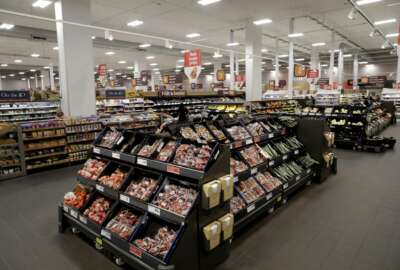 FILE- This April 30, 2018, file photo shows an interior view of the Sainsbury's flagship store in the Nine Elms area of London. British regulators say the proposed supermarkets merger between Sainsbury's and Walmart's Asda unit would push up prices and reduce quality for shoppers, casting doubt on a deal that would create the country's biggest grocery chain. (AP Photo/Matt Dunham, File)