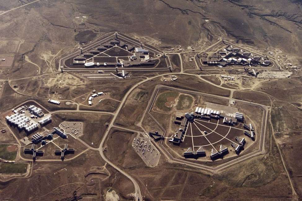 FILE - This Feb. 11, 2004, file photo provided by the Bureau of Prisons shows the Federal Correctional Complex in Florence, Colo. Clockwise from lower left is the minimum security Federal Prison Camp, the high security United States Penitentiary, the maximum security United States Penitentiary and the Federal Correctional Institution. Experts say the drug lord Joaquin "El Chapo" Guzman, who will be sentenced on June 25, 2019 for smuggling enormous amounts of narcotics into the U.S and having a hand in dozens of murders, seems the ideal candidate for the federal government's maximum security, "Supermax," prison, also known as ADX for "administrative maximum," a facility so secure, so remote and so austere that it has been called the "Alcatraz of the Rockies.". (Bureau of Prisons via The Gazette via AP, File)