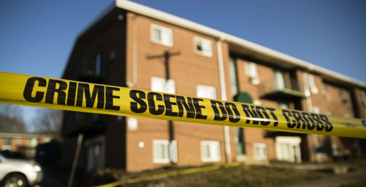 Crime scene tape surrounds the Robert Morris Apartments in Morrisville, Pa., Tuesday, Feb. 26, 2019. A woman and her teenage daughter are facing homicide charges in the deaths of multiple relatives, including children, inside an apartment at the complex in suburban Philadelphia, according to authorities. (AP Photo/Matt Rourke)