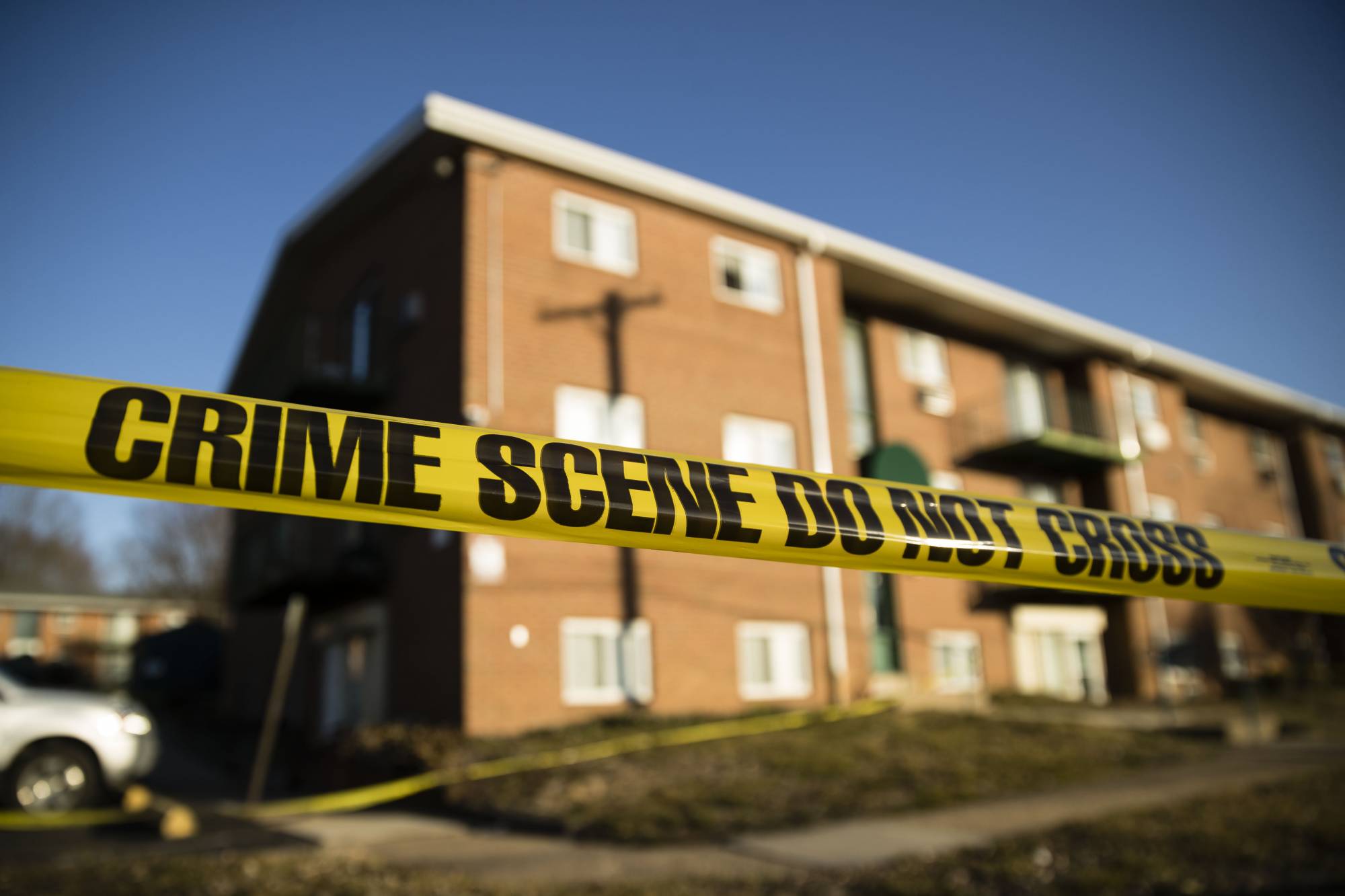 Crime scene tape surrounds the Robert Morris Apartments in Morrisville, Pa., Tuesday, Feb. 26, 2019. A woman and her teenage daughter are facing homicide charges in the deaths of multiple relatives, including children, inside an apartment at the complex in suburban Philadelphia, according to authorities. (AP Photo/Matt Rourke)