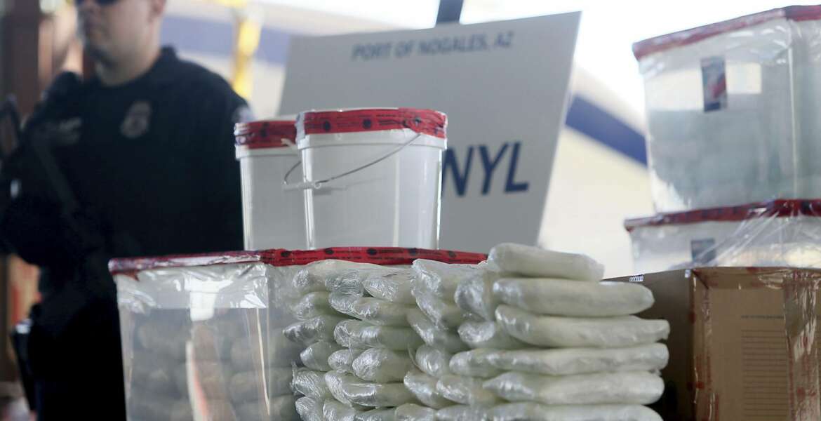 FILE - This Jan. 31, 2019 file photo shows a display of fentanyl and meth that was seized by Customs and Border Protection officers over the weekend at the Nogales Port of Entry at a press conference in Nogales, Ariz. Law enforcement officers in the U.S. Southwest say they have also seen fentanyl-laced pills mimicking Vicodin pain medicine and Xanax anti-anxiety tablets, as well as fentanyl powder to mix with heroin for an extra kick. Officers say that because the tablets are designed to look like prescription medicine, consumers often don't know they are swallowing fentanyl. And because they are made without any kind of quality control, taking them is like Russian roulette because the amount of fentanyl in each can vary widely. (Mamta Popat/Arizona Daily Star via AP, File)