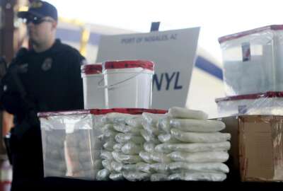 FILE - This Jan. 31, 2019 file photo shows a display of fentanyl and meth that was seized by Customs and Border Protection officers over the weekend at the Nogales Port of Entry at a press conference in Nogales, Ariz. Law enforcement officers in the U.S. Southwest say they have also seen fentanyl-laced pills mimicking Vicodin pain medicine and Xanax anti-anxiety tablets, as well as fentanyl powder to mix with heroin for an extra kick. Officers say that because the tablets are designed to look like prescription medicine, consumers often don't know they are swallowing fentanyl. And because they are made without any kind of quality control, taking them is like Russian roulette because the amount of fentanyl in each can vary widely. (Mamta Popat/Arizona Daily Star via AP, File)