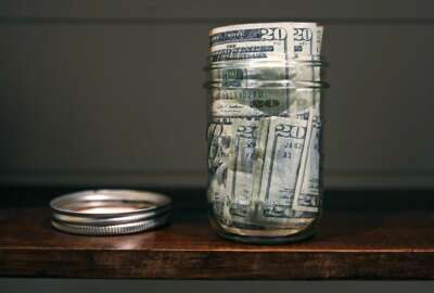 FILE - In this June 15, 2018, file photo a canning jar filled with currency sits on a shelf in East Derry, N.H. An emergency fund doesn’t have to be wishful thinking when you’re building your financial life. Start small to build a habit, use windfalls to kick-start your fund and have a plan for irregular expenses. (AP Photo/Charles Krupa, File)