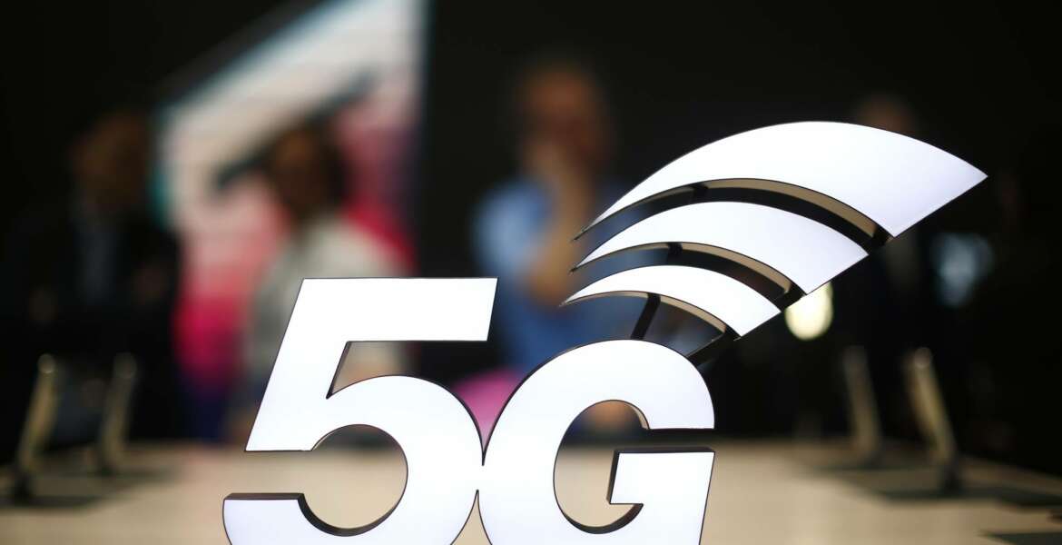 A banner of the 5G network is displayed during the Mobile World Congress wireless show, in Barcelona, Spain, Monday, Feb. 25, 2019. The annual Mobile World Congress (MWC) runs from 25-28 February in Barcelona, where companies from all over the world gather to share new products. (AP Photo/Manu Fernandez)