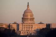 The light from the setting sun is reflected in the windows of the U.S. Capitol, Monday, Feb. 4, 2019, in Washington. (AP Photo/Alex Brandon)