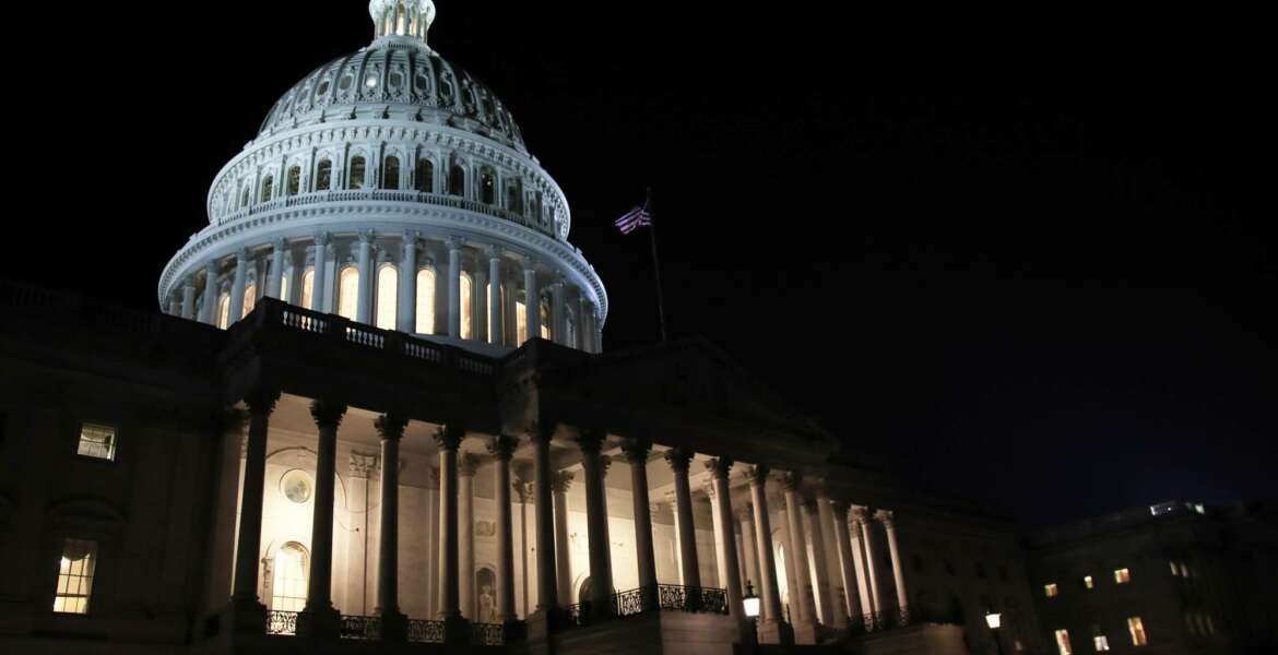 FILE- In this Feb. 5, 2019, file photo lights illuminate the U.S. Capitol dome in Washington. On Thursday, Feb. 14, the Labor Department reports on the number of people who applied for unemployment benefits last week. (AP Photo/Manuel Balce Ceneta, File)
