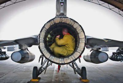 Senior Airman Nate Hall conducts a post-flight inspection on an F-16 Fighting Falcon July 5, 2013, at Kandahar Airfield, Afghanistan. Maintainers inspect aircraft for leaks, cracks or anything that may jeopardize the integrity of the aircraft. Hall is an aircraft maintainer deployed to the 451st Expeditionary Aircraft Maintenance Squadron. 
