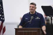 Adm. Karl Schultz, Coast Guard commandant, delivers the 2019 State of the Coast Guard Address at Coast Guard Base Los Angeles-Long Beach in San Pedro, Calif., Thursday, March 21, 2019. Strapped with an aging fleet, the U.S. Coast Guard is about to award a contract for a much-needed new icebreaker to help compete against Russia and China for a presence in the Arctic, but the service needs more funding for operations and infrastructure, its commandant said Thursday. (Seaman Ryan Estrada/U.S. Coast Guard via AP)