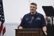 Adm. Karl Schultz, Coast Guard commandant, delivers the 2019 State of the Coast Guard Address at Coast Guard Base Los Angeles-Long Beach in San Pedro, Calif., Thursday, March 21, 2019. Strapped with an aging fleet, the U.S. Coast Guard is about to award a contract for a much-needed new icebreaker to help compete against Russia and China for a presence in the Arctic, but the service needs more funding for operations and infrastructure, its commandant said Thursday. (Seaman Ryan Estrada/U.S. Coast Guard via AP)