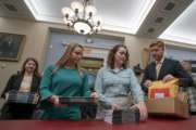 Office of Management and Budget staff delivers President Donald Trump's 2020 budget to the House Budget Committee on Capitol Hill in Washington, Monday, March 11, 2019. Trump's new budget calls for billions more for his border wall, with steep cuts in domestic programs but increases for military spending. (AP Photo/J. Scott Applewhite)