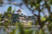 FILE - This Nov. 23, 2018 file photo shows President Donald Trump's Mar-a-Lago estate behind mangrove trees in Palm Beach, Fla. On Saturday, March 30, 2019, a woman carrying two Chinese passports and a device containing computer malware lied to Secret Service agents and briefly gained admission to the club over the weekend during his Florida visit, federal prosecutors allege in court documents. (AP Photo/J. David Ake)