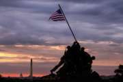 The U.S. Marine Corps War Memorial in Arlington, Va. is silhouetted against daybreak in the Washington, D.C. area Saturday morning May 25, 2019 at the outset of the Memorial Day weekend holiday. (AP Photo/J. David Ake)