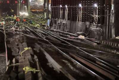 FILE- In this July 10, 2017 file photo, Amtrak workers repair tracks in New York's Penn Station. On Wednesday, May 1, 2019, Amtrak announced another round of summer schedule disruptions so they can make repairs to aging tracks and equipment at Penn Station. (AP Photo/Richard Drew, File)
