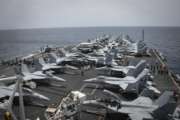 In this Sunday, May 19, 2019, photo released by the U.S. Navy, sailors partake in a foreign object and debris walk-down on the flight deck of the Nimitz-class aircraft carrier USS Abraham Lincoln. (Mass Communication Specialist 3rd Class Garrett LaBarge/U.S. Navy via AP)