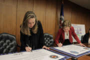 Acting OPM Director Margaret Weichert (left) and Lisa Hershman, DoD’s acting chief management officer, sign a MOU for the military to use OPM's USALearning platform.