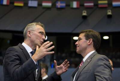 NATO Secretary General Jens Stoltenberg, left, speaks with acting U.S. Secretary for Defense Mark Esper during a meeting of the coalition to defeat Islamic State militants at NATO headquarters in Brussels, Thursday, June 27, 2019. (AP Photo/Virginia Mayo, Pool)