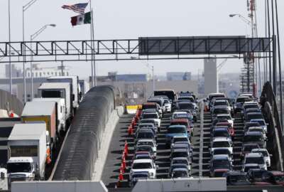 FILE - In this March 29, 2019, file photo, vehicles line up to enter the U.S. from Mexico at a border crossing in El Paso, Texas. Customs and Border Protection said Monday, June 10, that photos of travelers and license plates collected at a single U.S. border point have been exposed in a malicious cyberattack in what a leading congressman called a 
