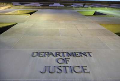 FILE - In this May 14, 2013, file photo, the Department of Justice headquarters building in Washington is photographed early in the morning. The Justice Department says Tuesday, July 2, 2019, the 2020 Census is moving ahead without a question about citizenship. (AP Photo/J. David Ake, File)