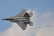 Top-view of an Air Force F-22 Raptor banking in flight.