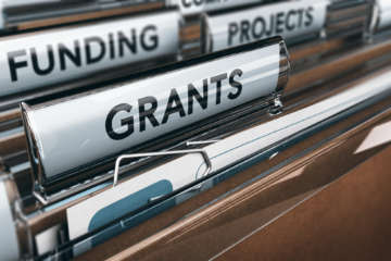 View of brown folders, with focus on grants label, Concept of funding, 3D illustration