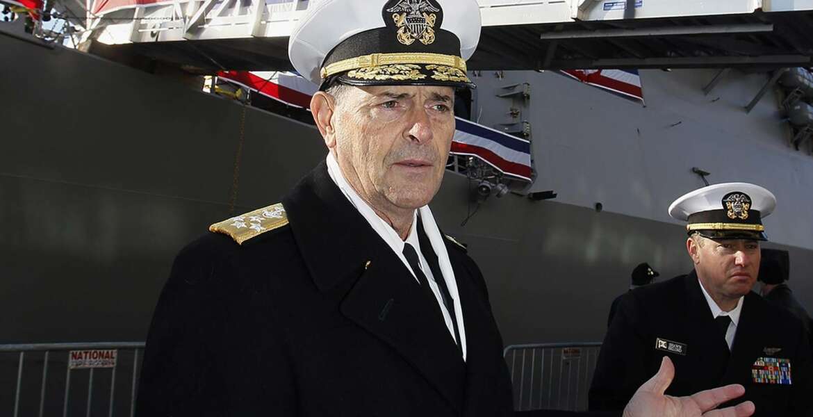 FILE - In this Dec. 1, 2018 file photo, Vice Chief of Naval Operations, Adm. William Moran describes the function of the USS Thomas Hudner prior to its commissioning ceremony  in Boston.  Moran, the Navy admiral set to become his service's top officer on Aug. 1, 2019, says he will instead retire. The extraordinary downfall of Moran was prompted by what Navy Secretary Richard Spencer on Sunday, July 7 called poor judgment. Spencer faulted Moran for having a professional relationship with a person who had been disciplined for what Spencer called 