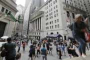 Pedestrians pass the New York Stock Exchange Friday, Aug. 23, 2019 in New York. Stocks fell sharply on Wall Street Friday after President Donald Trump called on U.S. companies to consider alternatives to doing business in China.(AP Photo/Frank Franklin II)