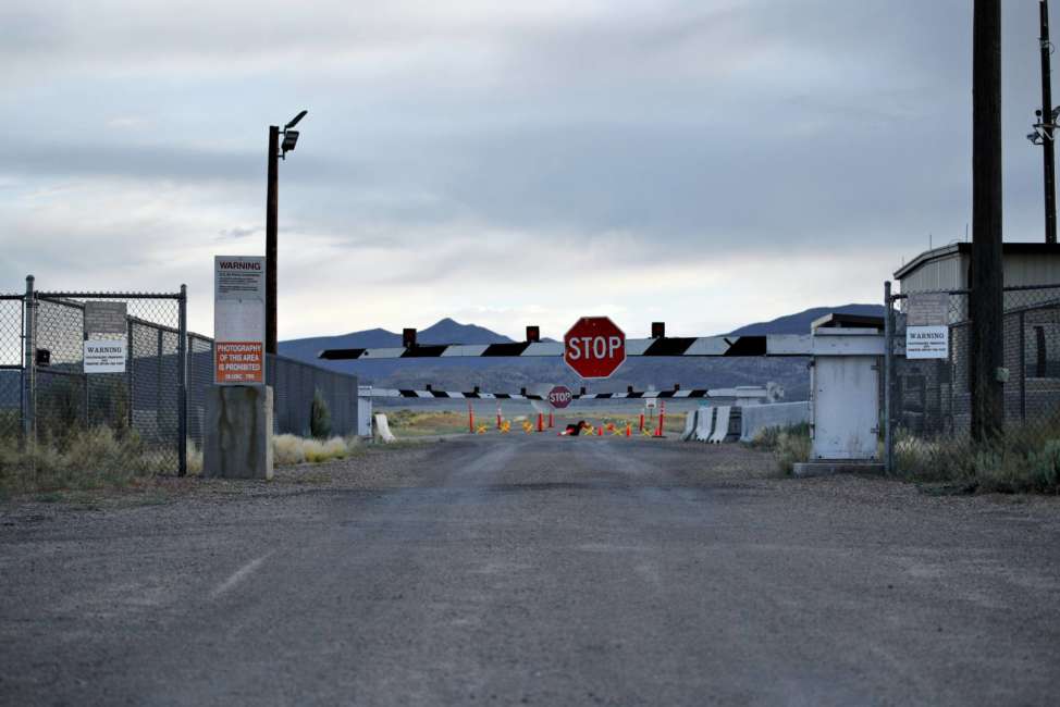 FILE - In this July 22, 2019 file photo, signs warn about trespassing at an entrance to the Nevada Test and Training Range near Area 51 outside of Rachel, Nev. Officials in Nevada's rural Lincoln County have drafted an emergency declaration and are planning with state officials to handle possible crowds that might arrive for an event next month dubbed "Storm Area 51." The county commission on Monday, Aug. 19, 2019 conditionally approved two events in tiny desert towns near the site popularly known as the home of government studies of outer space aliens. (AP Photo/John Locher, File)