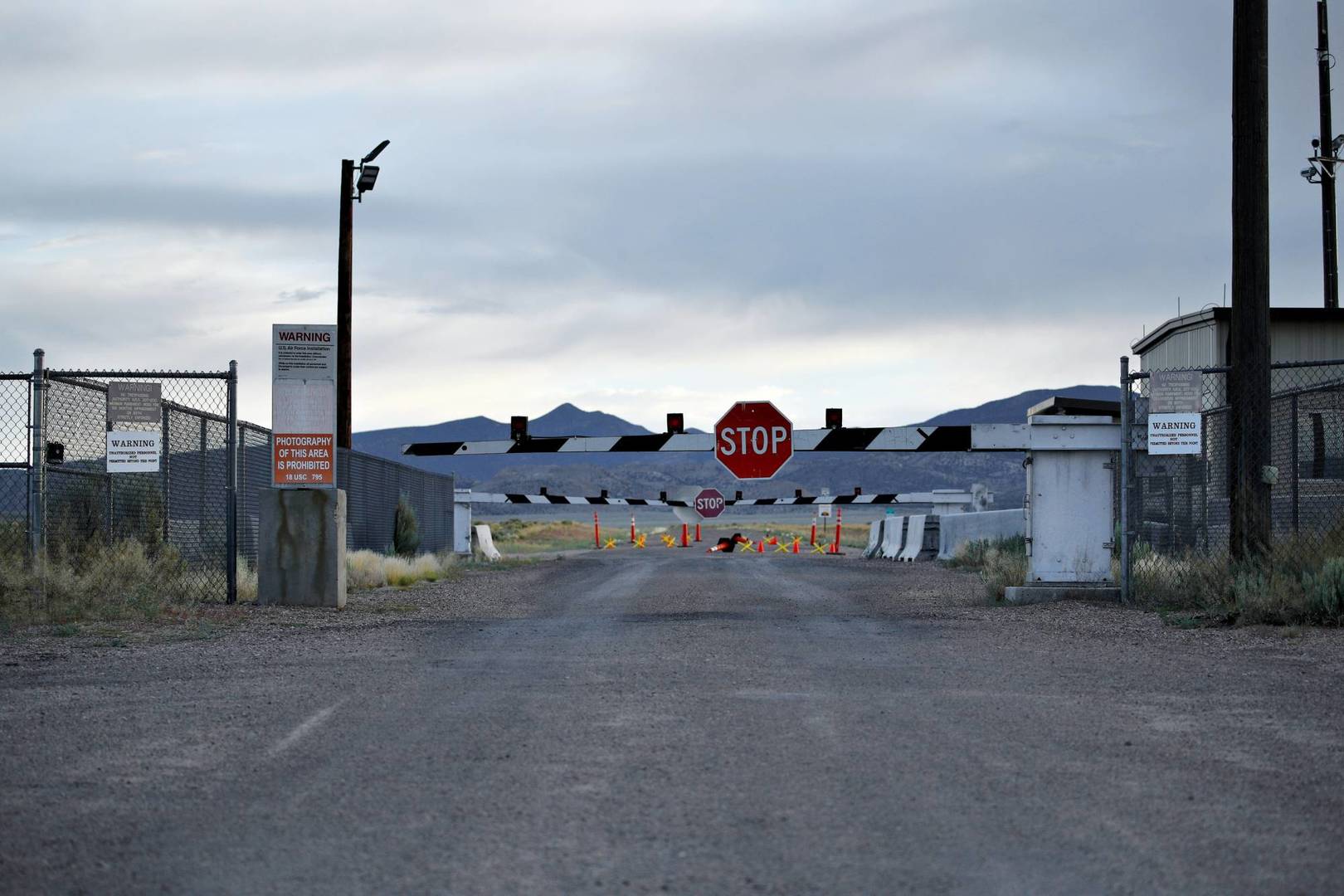 FILE - In this July 22, 2019 file photo, signs warn about trespassing at an entrance to the Nevada Test and Training Range near Area 51 outside of Rachel, Nev. Officials in Nevada's rural Lincoln County have drafted an emergency declaration and are planning with state officials to handle possible crowds that might arrive for an event next month dubbed 