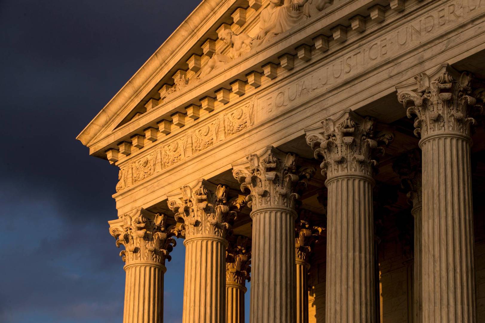 FILE - In this Oct. 10, 2017, file photo, the Supreme Court in Washington is seen at sunset.  The Supreme Court announced Aug. 23, 2019, that says Justice Ruth Bader Ginsburg has completed radiation therapy for a tumor on her pancreas and there is no evidence of the disease remaining.. (AP Photo/J. Scott Applewhite, File)