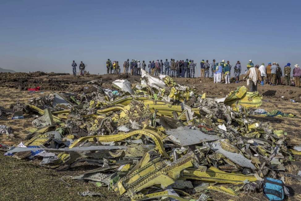 FILE - In this March 11, 2019, file photo, wreckage is piled at the crash scene of an Ethiopian Airlines flight crash outside Addis Ababa, Ethiopia. Ethiopian Airlines’ former chief engineer Yonas Yeshanew, who is seeking asylum in the U.S., says in a whistleblower complaint filed with regulators that the carrier went into maintenance records on a Boeing 737 Max jet after it crashed this year, a breach he contends was part of a pattern of corruption that included routinely signing off on shoddy repairs. (AP Photo/Mulugeta Ayene, File)