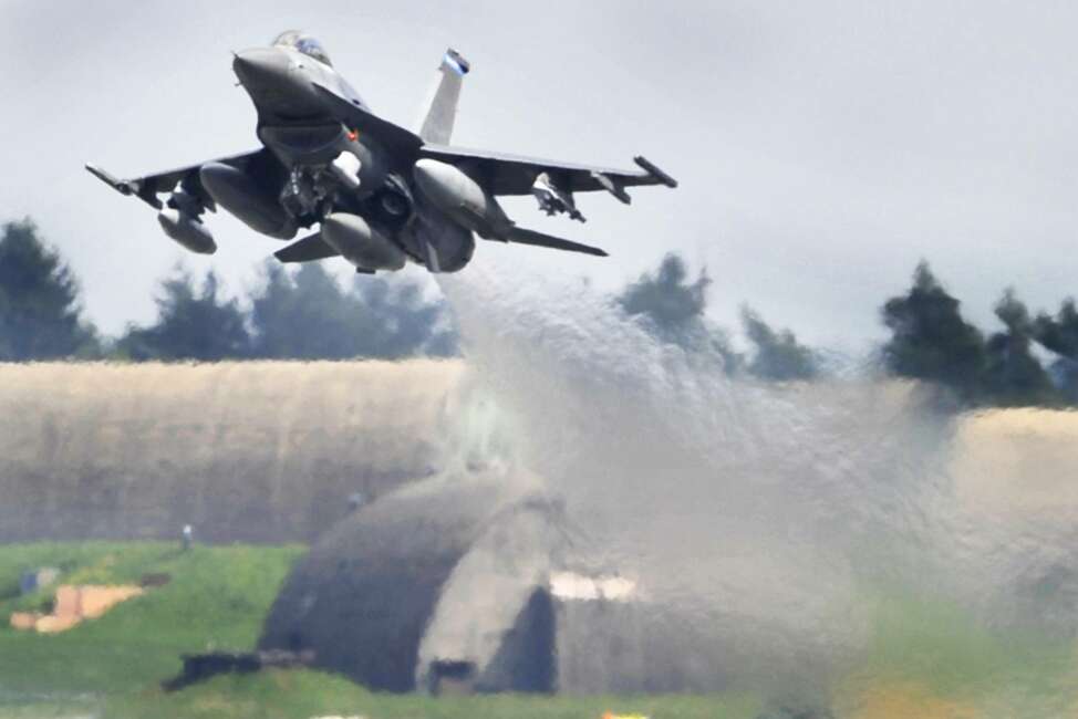 FILE - In this April 27, 2010 file photo an F-16 airplane lifts off at the US military Airport in Spangdahlem, Germany. The U.S. military says an F-16 fighter jet has crashed in western Germany but the pilot ejected to safety. Police said the plane came down in the Zemmer area, between the city of Trier and the U.S. Air Force's Spangdahlem Air Base. (Boris Roessler/dpa via AP, file)