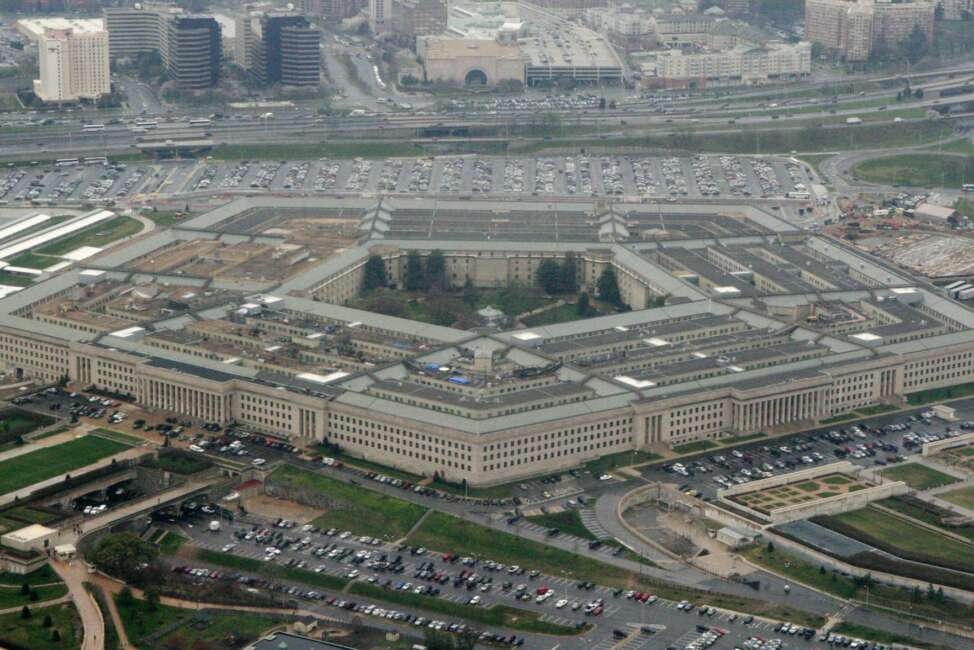 FILE - This March 27, 2008, aerial file photo, shows the Pentagon in Washington. Amazon is protesting the Pentagon’s decision to award a huge cloud-computing contract to Microsoft, citing “unmistakable bias” in the decision. Amazon’s competitive bid for the “war cloud” drew criticism from President Donald Trump and its business rivals. ((AP Photo/Charles Dharapak, File)