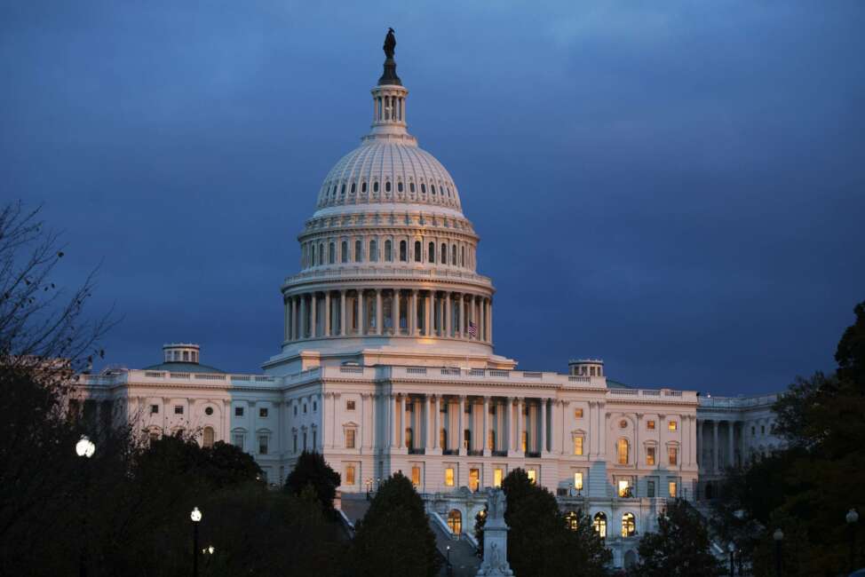 FILE - In this Tuesday, Nov. 12, 2019, file photo, the U.S. Capitol is seen as the sun sets in Washington. Negotiations on a package of spending bills to fund the federal government have produced a key breakthrough, though considerably more work is needed to wrap up the long-delayed measures. Top lawmakers of the House and Senate Appropriations committees on Saturday, Nov. 23, confirmed agreement on allocations for each of the 12 spending bills. (AP Photo/Manuel Balce Ceneta, File)