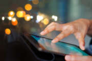 Businessman using tablet at night time