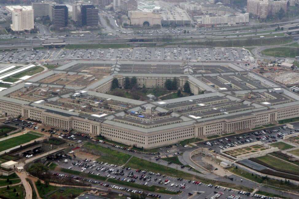 FILE - In this March 27, 2008 file photo, an aerial view of the Pentagon is seen in Washington. Amazon must decide soon if it will protest the Pentagon’s awarding of a $10 billion cloud computing contract to rival Microsoft on Oct. 25, 2019, with one possible grievance being the unusual attention given to the project by President Donald Trump. (AP Photo/Charles Dharapak, File)