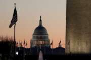 The U.S. Capitol building, center, and part of the Washington Monument, right, are seen at sunrise, Wednesday, Dec. 18, 2019, on Capitol Hill in Washington. President Donald Trump is on the cusp of being impeached by the House, with a historic debate set Wednesday on charges that he abused his power and obstructed Congress ahead of votes that will leave a defining mark on his tenure at the White House. (AP Photo/Julio Cortez)