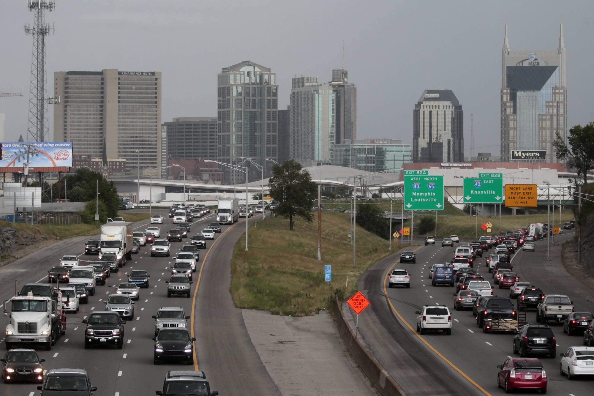 FILE- In this June 26, 2015, file photo, heavy traffic moves away from and toward the downtown area of Nashville, Tenn. From the middle of the Obama administration to the midpoint of the Trump administration, household income grow the most in growing tech and entertainment centers like in Austin, Nashville, Pittsburgh and large chunks of the West Coast, while it declined the most in former manufacturing and mining hubs like High Point, N.C., and Scranton, Pa., according to new figures released by the U.S. Census Bureau. (AP Photo/Mark Humphrey, File)