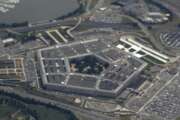 FILE - In this June 3, 2011, file photo, the Pentagon is seen from air from Air Force One. The House has passed its annual defense policy measure, which combines a $738 billion Pentagon price tag with legislation to provide federal employees with 12 weeks of paid parental leave. (AP Photo/Charles Dharapak, File)