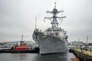 FILE - In this Sept. 6, 2019 file photo, the U.S. Navy Arleigh Burke-class guided missile destroyer USS Lassen (DDG-82) moors at Fort Trumbull State Park in New London, Conn.  The Navy is proposing construction cutbacks and accelerated ship retirements that would delay, or sink, the Navy’s goal of a larger fleet — and potentially hurt shipyards, according to an initial proposal.    The proposal would shrink the size of the fleet from today’s level of 293 ships to 287 ships, a far cry from the official goal of 355 ships established in the 2018 National Defense Authorization Act.  (Sean D. Elliot/The Day via AP, File)