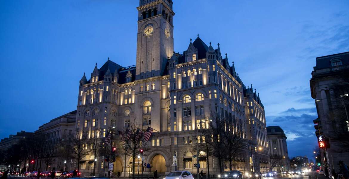 FILE - In this Jan. 23, 2019, file photo, the Trump International Hotel near sunset in Washington. A federal appeals court is set to rehear arguments Thursday, Dec. 12, in a lawsuit that accuses President Donald Trump of illegally profiting off the presidency through his luxury Washington hotel. (AP Photo/Alex Brandon, File)