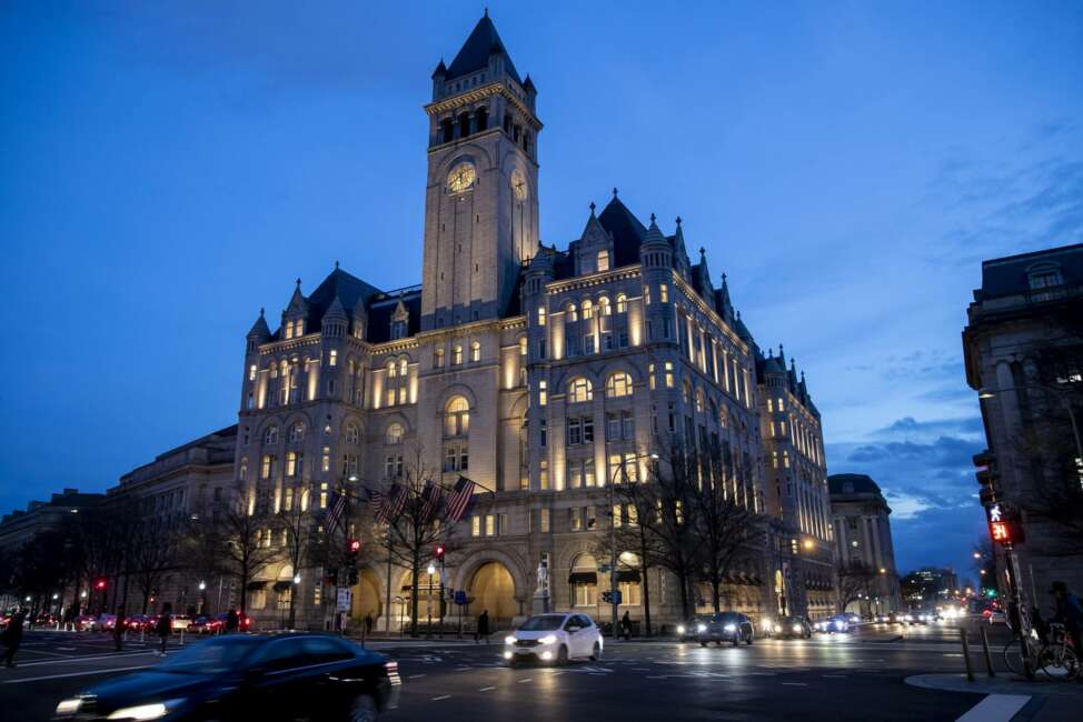 FILE - In this Jan. 23, 2019, file photo, the Trump International Hotel near sunset in Washington. A federal appeals court is set to rehear arguments Thursday, Dec. 12, in a lawsuit that accuses President Donald Trump of illegally profiting off the presidency through his luxury Washington hotel. (AP Photo/Alex Brandon, File)