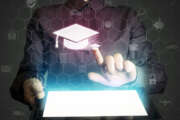 Image of a girl with a tablet in hands. She presses on the icon graduation hat cap. Online education concept, choose of career