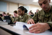 U.S. Air Force basic military training trainees are issued personal computers during in-processing as part of a pilot test under a Cooperative Research and Development Agreement partnership at Joint Base San Antonio-Lackland, Texas, Dec. 11, 2019. The computers replace all hard copy

textbooks BMT trainees currently use with the intent to help BMT assess learning outcomes, value and return on investment. (U.S. Air Force photo by Sarayuth Pinthong)