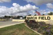 FILE - This Friday, March 17, 2019 file photo shows the main entrance to March Air Reserve Base in Riverside, Calif.  Nearly 200 Americans evacuated from China because of the new virus are "very relieved' to be quarantined at March Air Reserve Base, a military base in Southern California for two weeks, one of them said Friday, Jan. 31, 2020. (AP Photo/Amy Taxin, File)