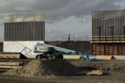 FILE - In this Nov. 7, 2019 file photo, the first panels of levee border wall are seen at a construction site along the U.S.-Mexico border, in Donna, Texas. The Trump administration said Tuesday, Feb. 18, 2020, that it will waive federal contracting laws to speed construction of the border wall with Mexico. (AP Photo/Eric Gay, File)